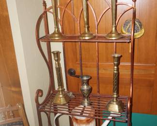 bakers rack, brass candle sticks