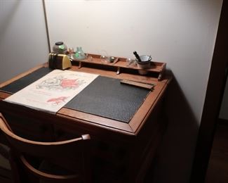 desk  with  inkwell  slots,  needlepoint  chair  