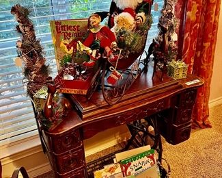 Antique sewing machine with treadle. 