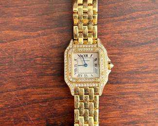 Women’s 18k Cartier watch with diamonds