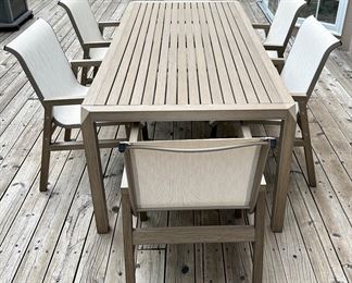 Beautiful and Contemporary Outdoor Dining Table and 6 Sling Outdoor Dining Chairs from"The Great Escape" only 2 years old...