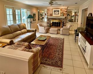 Beautiful Family Room including Leather Recliner Sofa from Walter E. Smith, Samsung UHD 55" TV, Occasional Tables by Charleston Forge, 