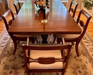 Duncan Phyfe 1930's Dining Table with 3 Leaves and Custom pads.  Total of 6 Dining Chairs with One Armed Chair. The Table has 2 Pedestals.  60" L x 40" W with 3 10" Leaves. 