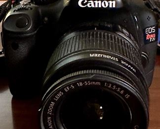 Canon EOS Rebel T2i DSLR Camera with Canon 18-55mm Lens. Includes 2 Batteries, Battery Charger and the Canon DSLR Camera Bag