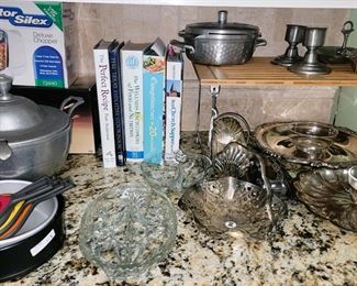 Silver plate and pewter serving pieces, cook books, cooking tools