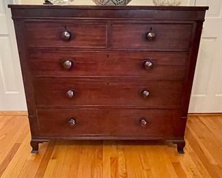 Antique French Empire-style 5-drawer chest of drawers with fluted pilasters on the frame, dove-tailed drawer construction, turned drawer pulls, and lovely carved feet.