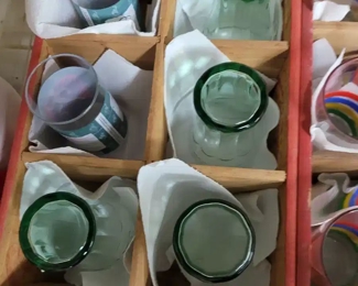 Vintage Coca-Cola glasses and Coke bottling crate.