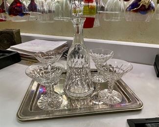 Crystal wine decanter and four crystal champaign glasses.