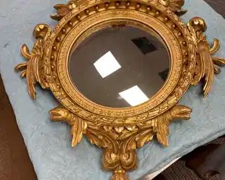 Federal style large convex mirror with eagle. Overall dimensions 30”x41”. Mirror alone is 15-1/2” in diameter. 