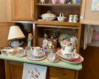 Antique Hoosier Cabinet filled with vintage, antiques, dishes and serving pieces