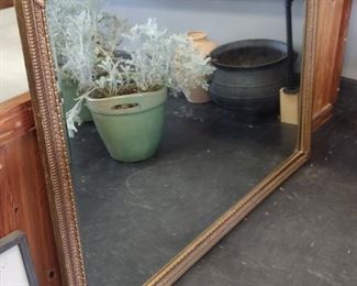 Extremely large ornate gold framed mirror