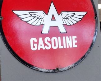 reproduction flying a gasoline porcelain sign