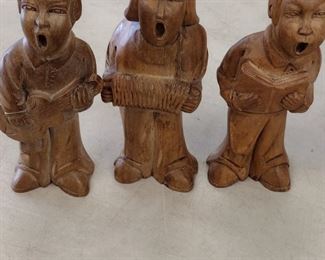 carved wood carolers