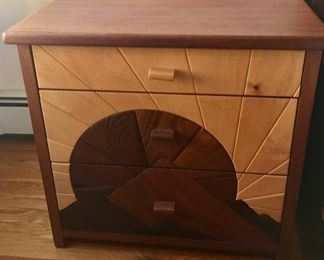 One of two hand carved night tables by Sam Quintana