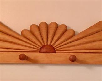 Hand carved coat hanger