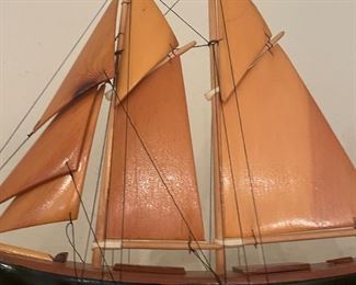 Wood carved sailboat with wooden sails 