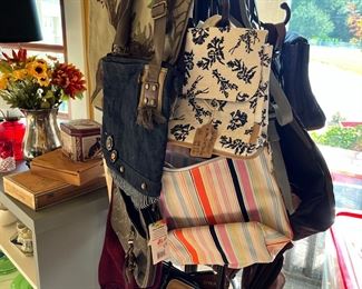 Many new purses with tags