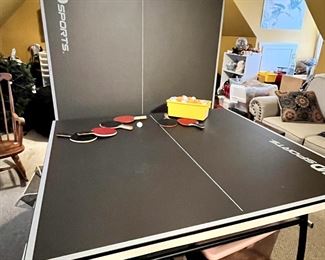 Folding ping pong table, with wheels to fold and store. Excellent condition, with paddles and balls, $175