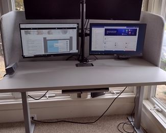 Steelcase electric adjustable desk with 4 monitors and monitor tree $700