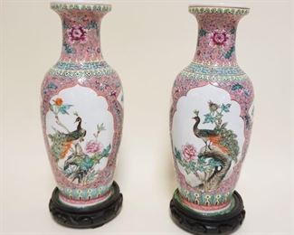 1053	PAIR OF ASIAN VASES ON WOOD BASES, VASES ATTACHED TO WOOD BASES, APPROXIMATELY 14 IN
