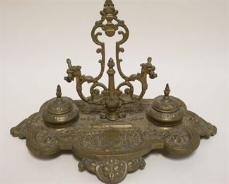 1065	ORNATE VICTORIAN BRASS DOUBLE INKWELL & PEN HOLDER, APPROXIMATELY 13 IN X 10 IN X 9 IN HIGH
