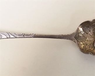 1077	ORNATE CONTINENTAL SILVER SPOON W/EMBOSSED DESIGNS, 1.38 OZT, TOUCH MARKS ON REVERSE
