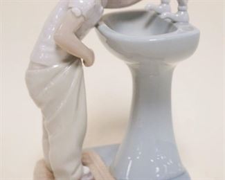 1085	LLADRO YOUNG GIRL AT SINK, APPROXIMATELY 8 IN HIGH
