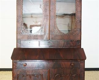 1103	FLAMED MAHOGANY EMPIRE STYLE 2 PART SECRETARY DESK W/FRETWORK CUT OUT TRIM ON DOORS, APPROXIMATELY 49 IN X 21 IN X 89 IN HIGH
