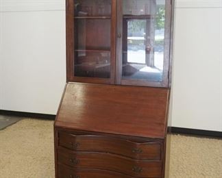 1134	MAHOGANY SECRETARY DESK W/DOUBLE DOOR BOOKCASE TOP, APPROXIMATELY 35 IN X 19 IN X 84 IN HIGH
