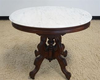 1147	WALNUT VICTORIAN OVAL MARBLE TOP PARLOR TABLE, APPROXIMATELY 34 IN X 25 IN X 30 IN HIGH
