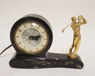 1241	ELECTRIC CLOCK W/FIGURE OF GOLFER, APPROXIMATELY 8 IN X 2 1/2 IN X 5 1/2 IN HIGH
