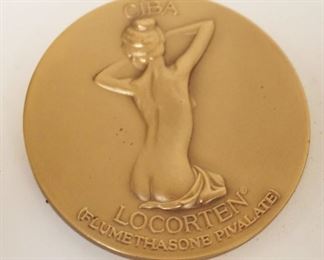 1243	BRONZE COMMEMORATIVE COIN MEDDALIC ART CO NY OF NUDE WOMAN, APPROXIMATELY 2 1/2 IN
