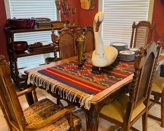 beautiful dining table and six chairs --Do you see the wooden Swan decoy?