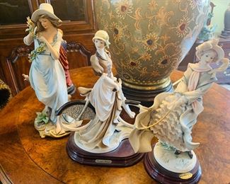 Armani figures of three young ladies