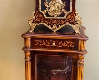 Glass front Tiffany marquetry stand that matches clock.. Both parts are made in Italy
