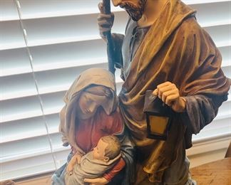 a beautifully carved and hand painted scene of the Holy Family