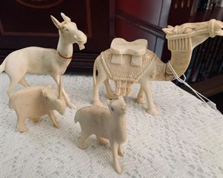 Four carved bone figures