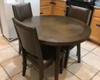 Round dining table with 4 chairs (1 not pictured)