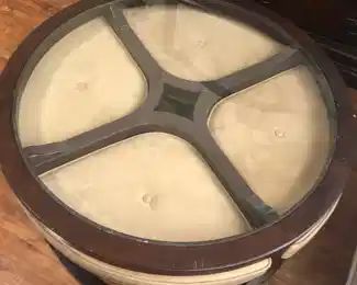 Coffee table with 4 pull out ottomans