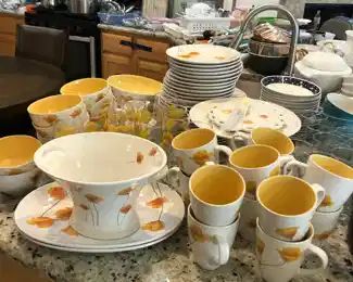 Pfaltzgraff set with plates, bowls, mugs, glasses, cake plate, serving knife, and more