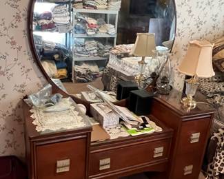 Antique dresser with round mirror