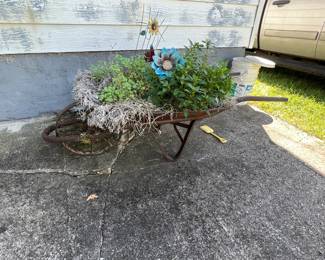 Antique wheelbarrow with metal wheel