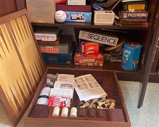 Game cupboard full of games, some vintage. Poker table with removable top and folding legs! Dozens of playing cards, card shuffler, and card games