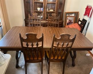 #15		"Spanish baroque style ""Oak"" dining room table w/ lyre legs. 4 carved wood chairs w/ yellow crushed velvet cushions. 66""-77.5""x42""x28"""	($ 225.00)