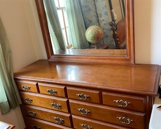 #35		"Maple 10 drawer dresser w/ brass hardware w/ attached mirror. *As is Finish*. 55""x19""x32.5"". Mirror 33""H x 39""W"	($ 200.00)
