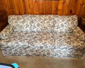 #40		Ivory and Mauve floral sleeper sofa 7'.	($ 75.00)