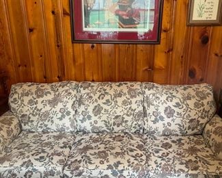 #40		Ivory and Mauve floral sleeper sofa 7'.	($ 75.00)