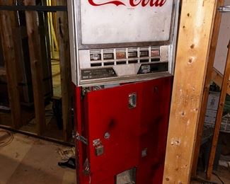Antique Coca-Cola can dispenser