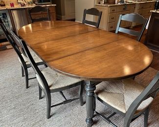 Dining table with 6 ladderback rush seats, black trim