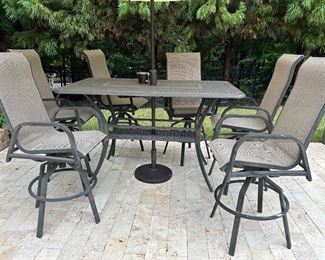 5’7” by 3’3” umbrella table with 6 chairs
